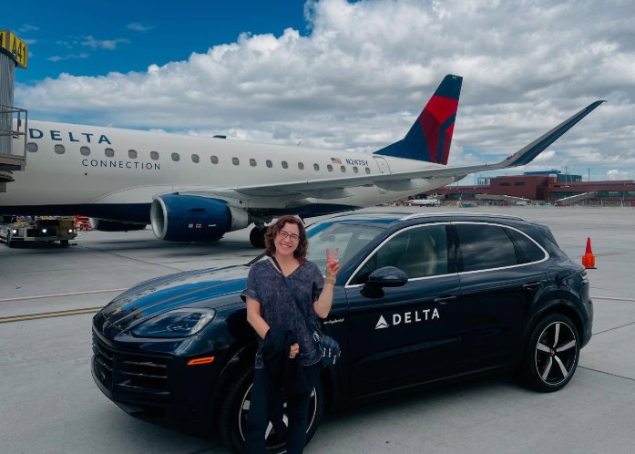A Delta customer with a Porsche on the tarmac